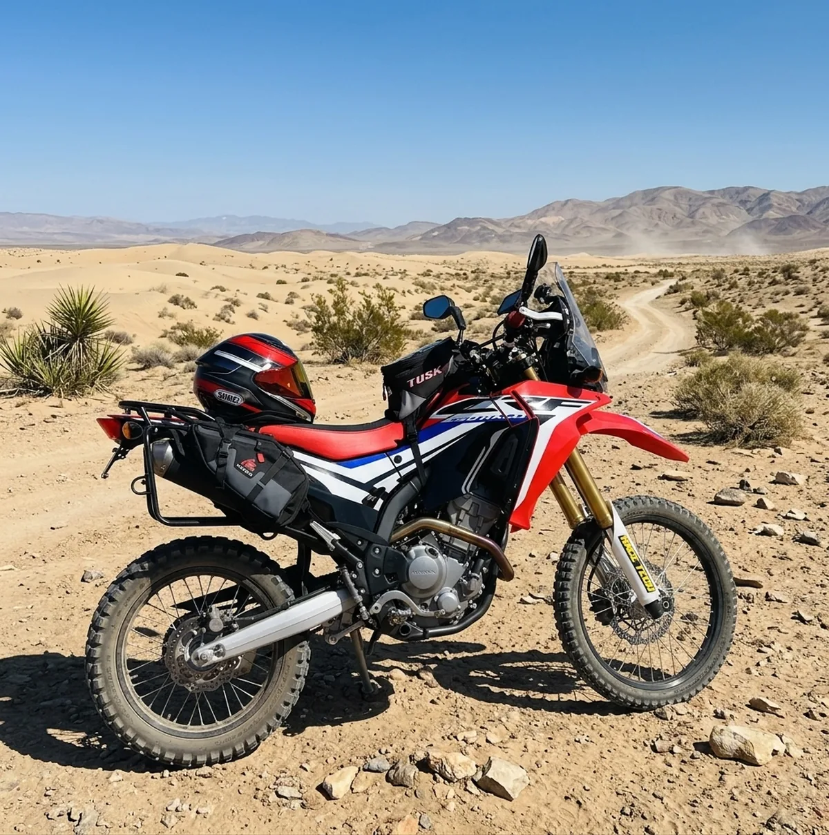 Honda CRF250 Rally loaded with Tusk luggage on a desert dirt road